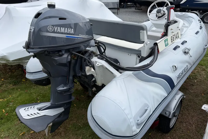 Slide: The Image of 2019 Highfield Classic 380 inflatable boat with Yamaha outboard motor on grass. - 2