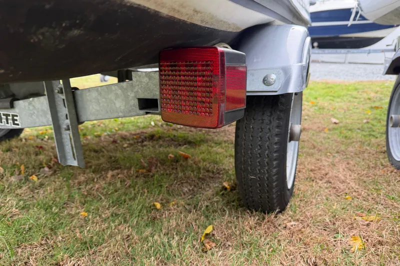 Slide: The Image of Trailer light and wheel of 2019 Highfield Classic 380 boat on grass. - 20