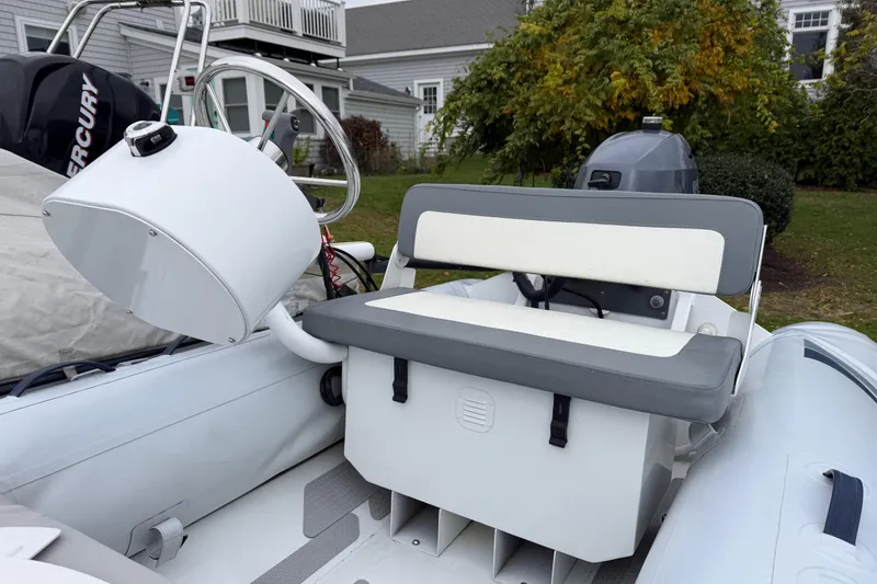 Slide: The Image of 2019 Highfield Classic 380 boat interior with steering wheel and seating. - 7