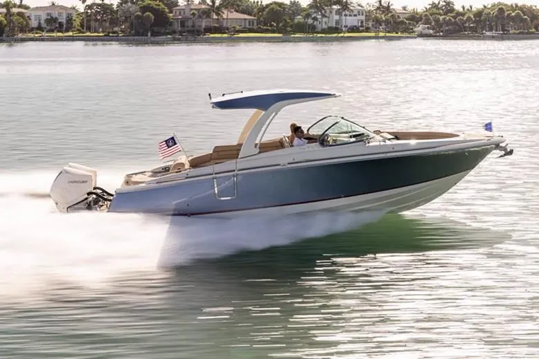 Slide: The Image of Manufacturer Provided Image: 2025 Chris-Craft Launch 31 GT speeding on water, showcasing sleek design and performance. - 4