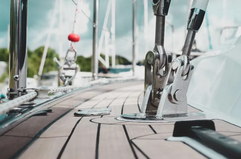 Slide: The Image of Close-up of 2025 Southerly 480 yacht deck with polished fittings and wooden finish. - 13
