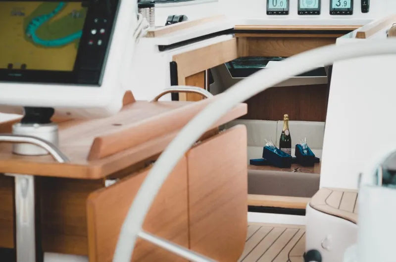 Slide: The Image of Interior of 2025 Southerly 480 yacht with navigation equipment and champagne. - 14