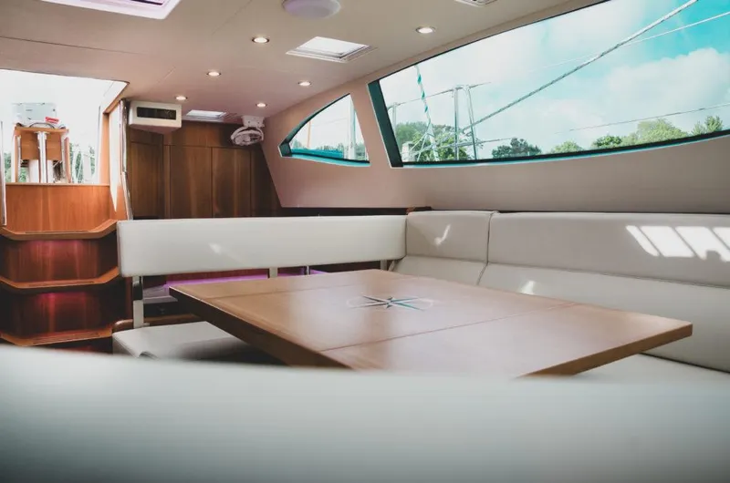 Slide: The Image of Luxurious interior of 2025 Southerly 480 yacht with modern seating and large windows. - 17