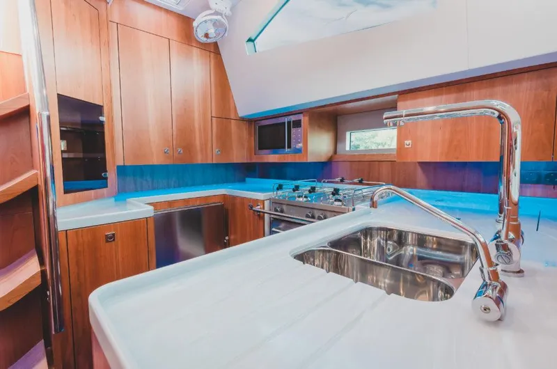 Slide: The Image of Modern kitchen interior of 2025 Southerly 480 yacht with sleek design and stainless steel fixtures. - 22
