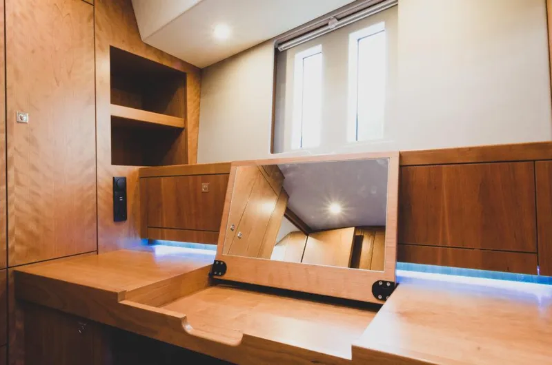Slide: The Image of Luxurious wooden interior of 2025 Southerly 480 yacht with mirror and shelving. - 26