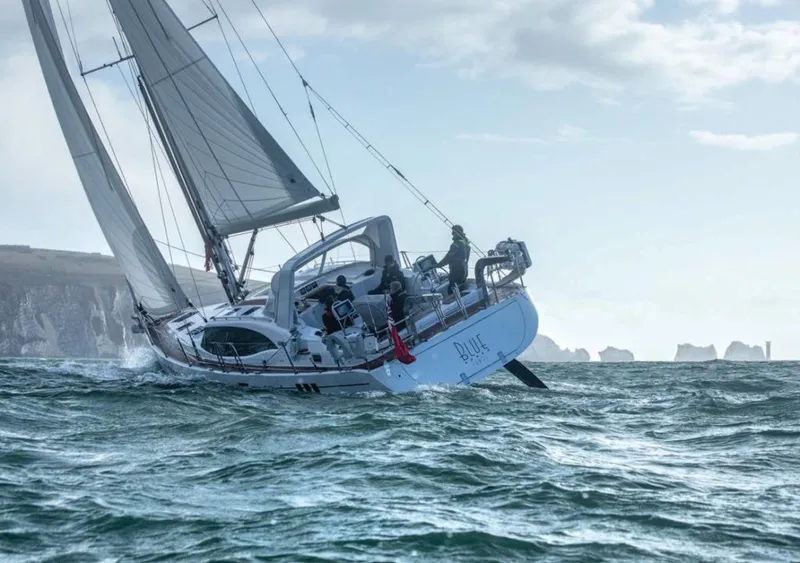 Slide: The Image of Sailing yacht Southerly 480 (2025) navigating rough seas with cliffs in the background. - 31