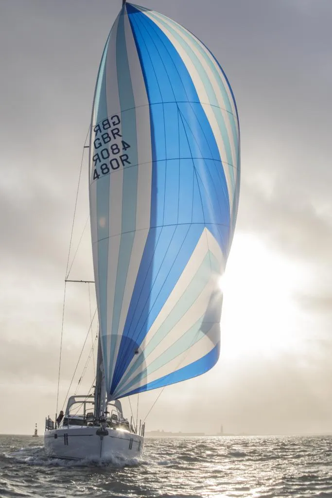 Slide: The Image of Sailing yacht Southerly 480 (2025) with blue and white spinnaker on open water. - 33