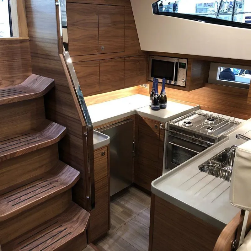 Slide: The Image of Luxurious 2025 Southerly 480 yacht interior with modern kitchen and wooden staircase. - 41