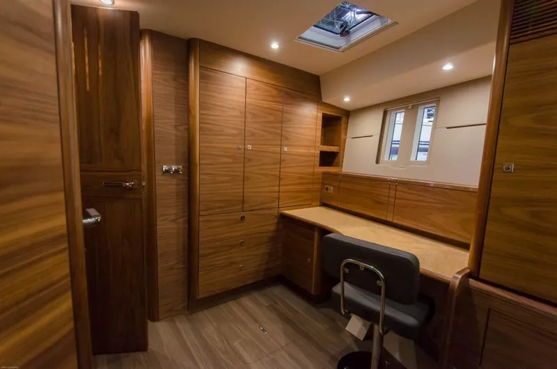 Slide: The Image of Luxurious interior of 2025 Southerly 480 yacht with wooden cabinetry and skylight. - 45