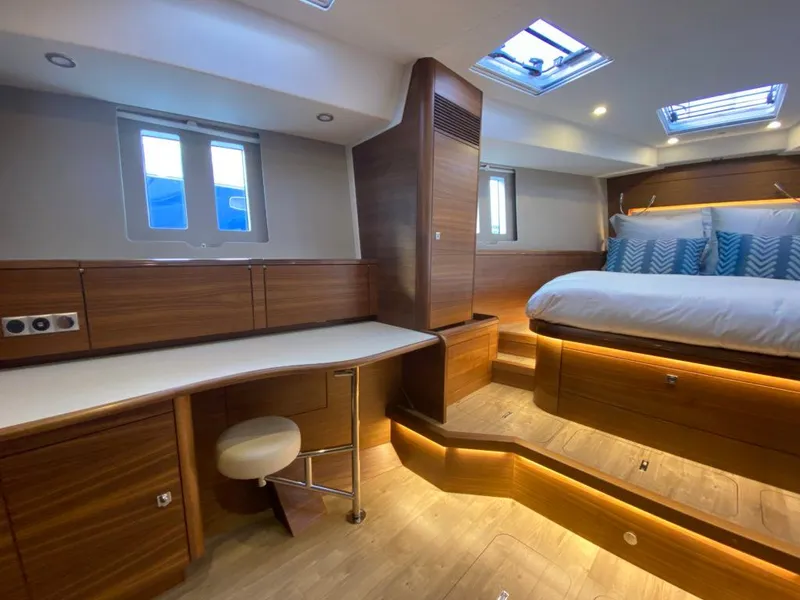 Slide: The Image of Luxurious interior of 2025 Southerly 480 yacht with modern wood finish and cozy bedding. - 46