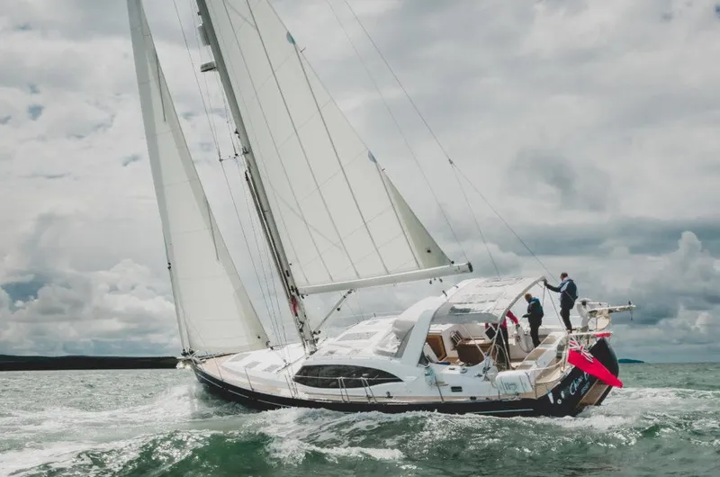 Slide: The Image of Sailing yacht Southerly 480, 2025 model, navigating through ocean waves under cloudy skies. - 5