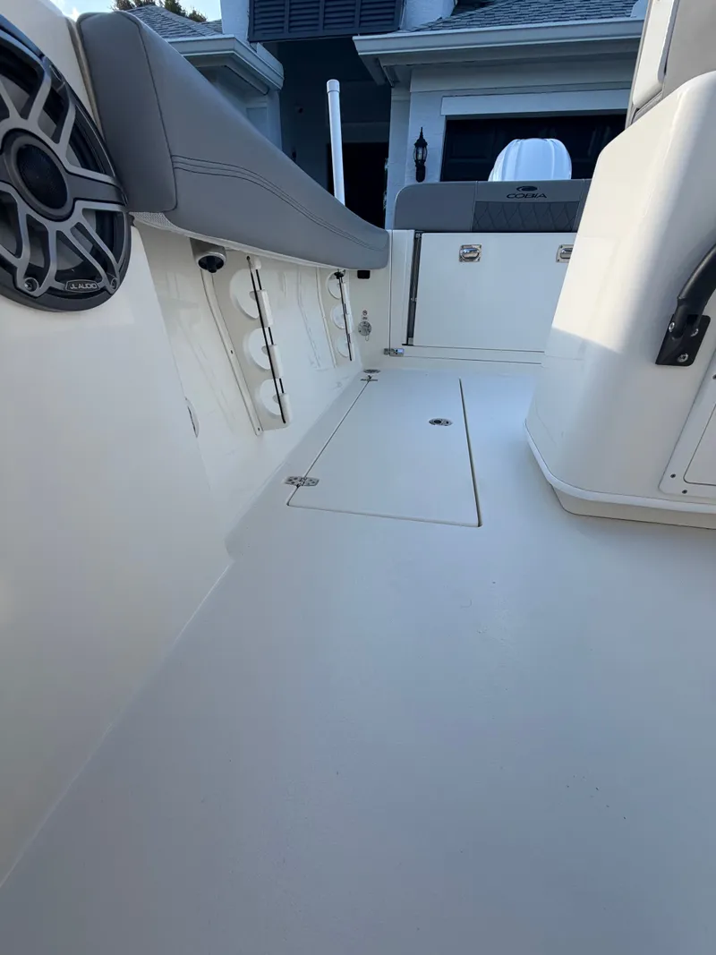 Slide: The Image of Interior view of 2024 Cobia 240 Center Console boat deck. - 11