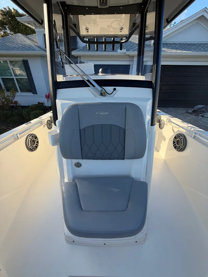 Slide: The Image of 2024 Cobia 240 Center Console boat with gray seating. - 15