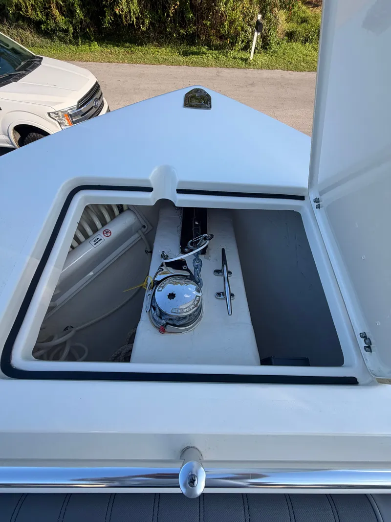 Slide: The Image of 2024 Cobia 240 Center Console anchor locker open. - 17