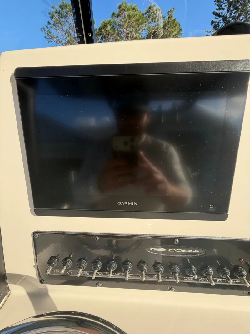 Slide: The Image of Garmin display on 2024 Cobia 240 Center Console boat. - 25
