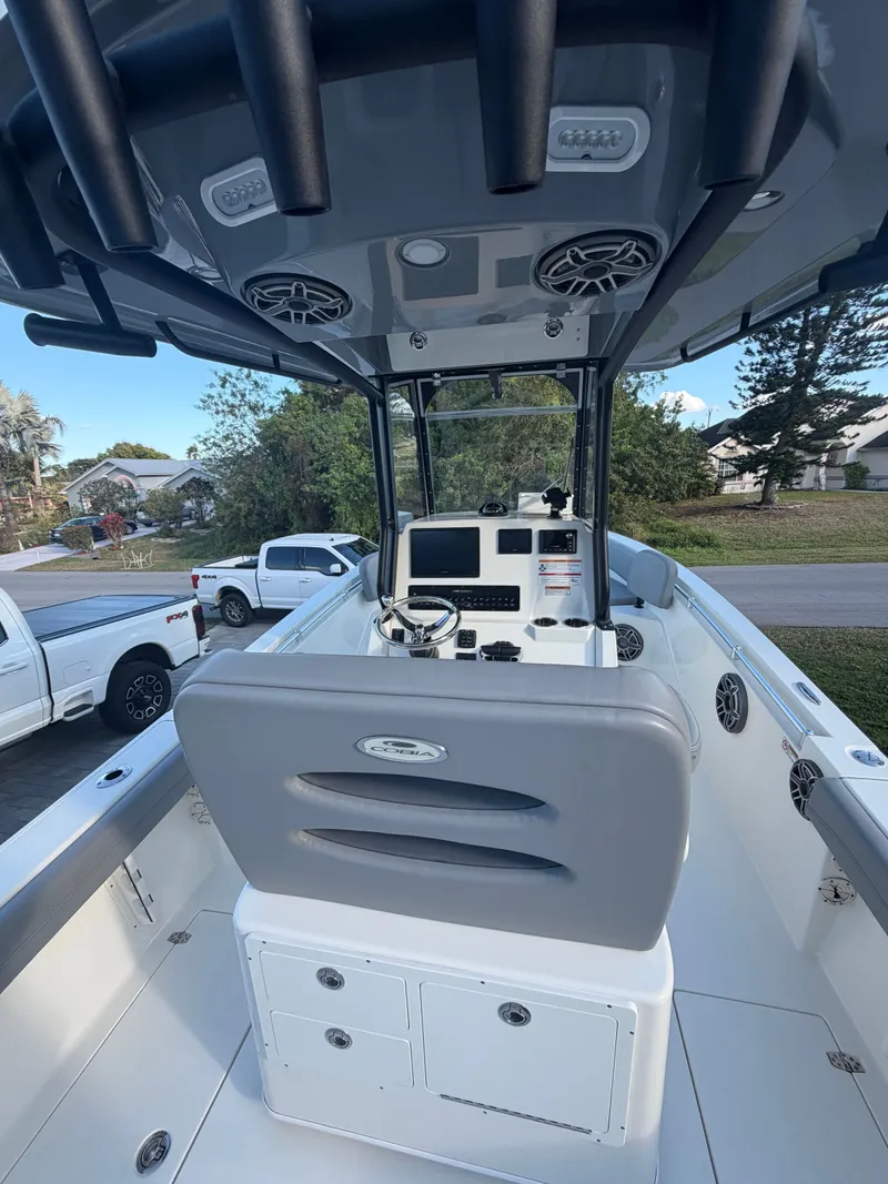 Slide: The Image of 2024 Cobia 240 Center Console boat cockpit view. - 4