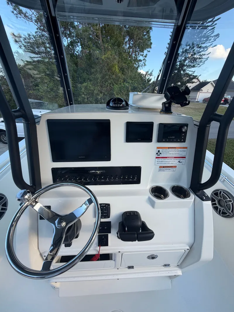 Slide: The Image of Cobia 240 Center Console 2024 helm with modern electronics. - 8
