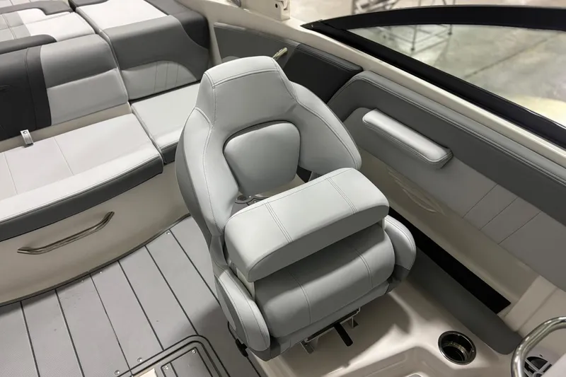 Slide: The Image of 2026 Chaparral 21 SSi boat interior with gray seating and modern design. - 15