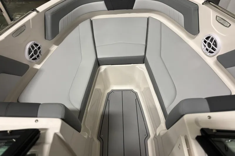 Slide: The Image of 2026 Chaparral 21 SSi boat interior with gray seating and built-in speakers. - 16
