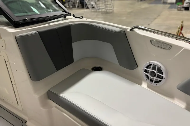 Slide: The Image of 2026 Chaparral 21 SSi boat interior with gray seating and speaker detail. - 17
