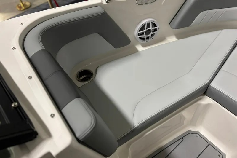 Slide: The Image of 2026 Chaparral 21 SSi boat interior with gray seating and speaker detail. - 18