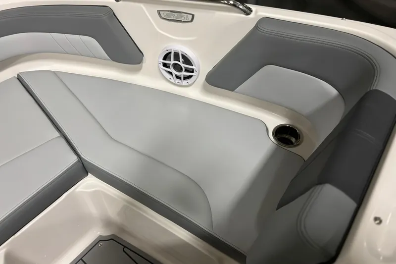 Slide: The Image of 2026 Chaparral 21 SSi boat interior with gray seating and speaker detail. - 19
