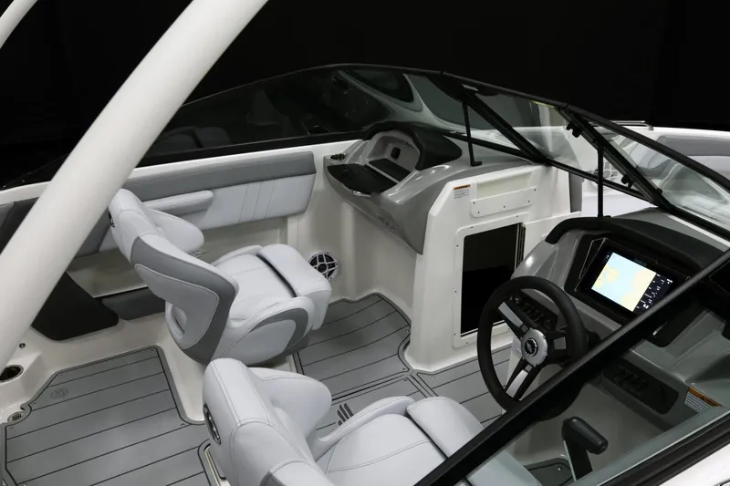 Slide: The Image of Manufacturer Provided Image: 2026 Chaparral 21 SSi boat interior with modern dashboard and seating. - 28