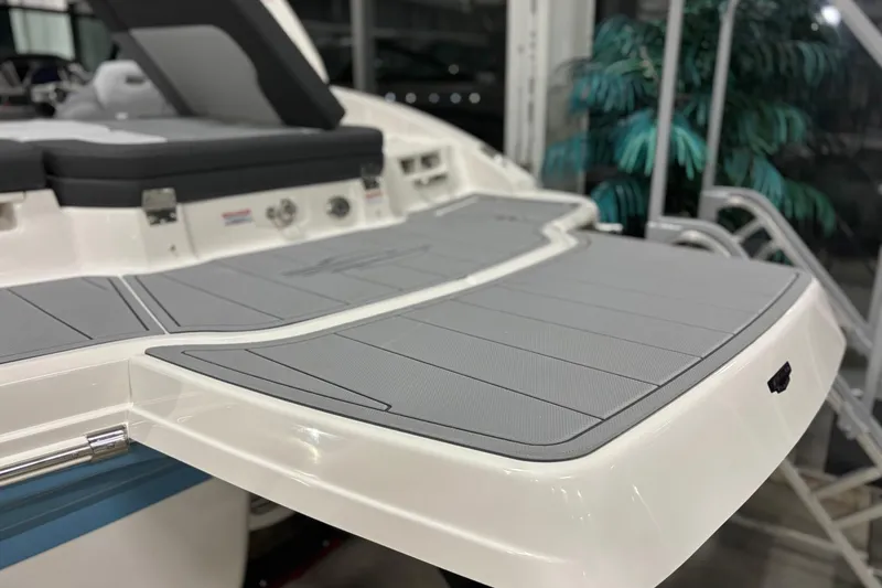 Slide: The Image of 2026 Chaparral 21 SSi boat swim platform with gray padding and sleek design. - 4