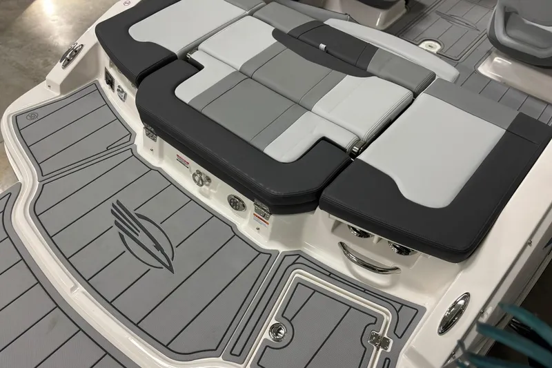 Slide: The Image of 2026 Chaparral 21 SSi boat with sleek gray seating and deck design. - 5
