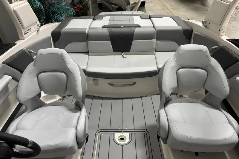 Slide: The Image of 2026 Chaparral 21 SSi boat interior with sleek gray seating and modern design. - 8