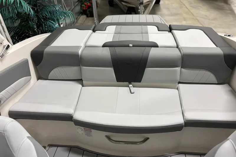 Slide: The Image of 2026 Chaparral 21 SSi boat interior with gray and white cushioned seating. - 9