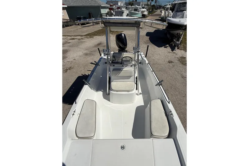 Slide: The Image of 2003 Kenner 21 V Tunnel boat console with steering wheel and navigation equipment. - 10