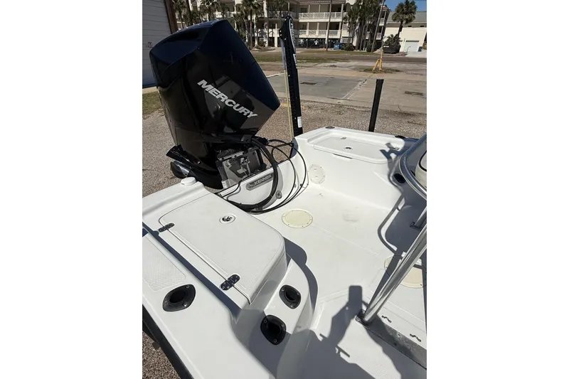 Slide: The Image of 2003 Kenner 21 V Tunnel boat interior with steering console and canopy. - 13