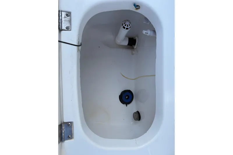 Slide: The Image of 2003 Kenner 21 V Tunnel boat compartment with plumbing and fittings. - 17