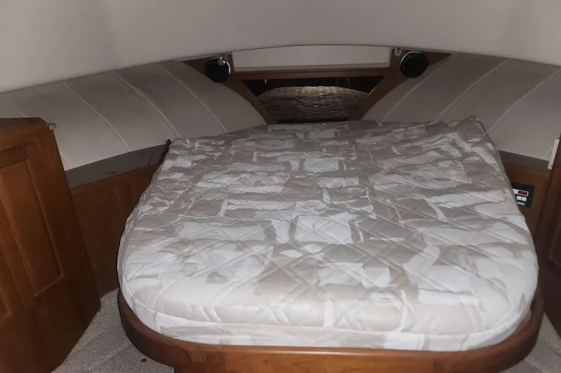 Slide: The Image of Cozy cabin bed in 1997 Mainship 350 Trawler with quilted mattress. - 12
