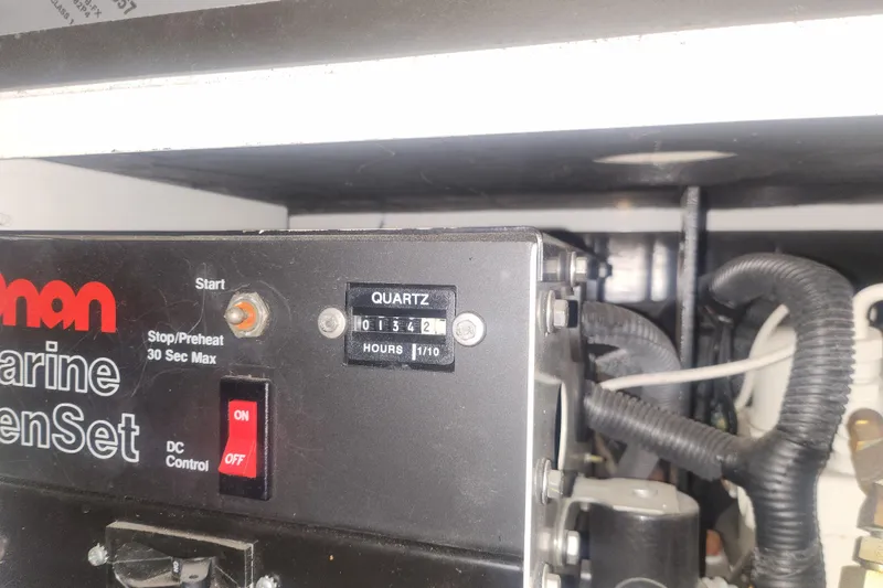 Slide: The Image of Control panel of a 1997 Mainship 350 Trawler's marine generator set. - 22