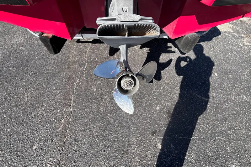 Slide: The Image of Propeller of 2008 Regal 2000 Bowrider boat on asphalt surface. - 11