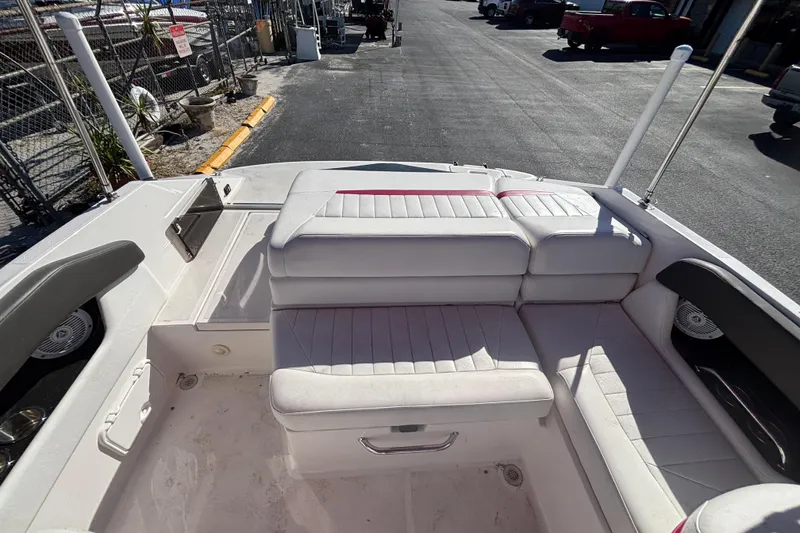 Slide: The Image of 2008 Regal 2000 Bowrider interior with white seating and storage compartments. - 17