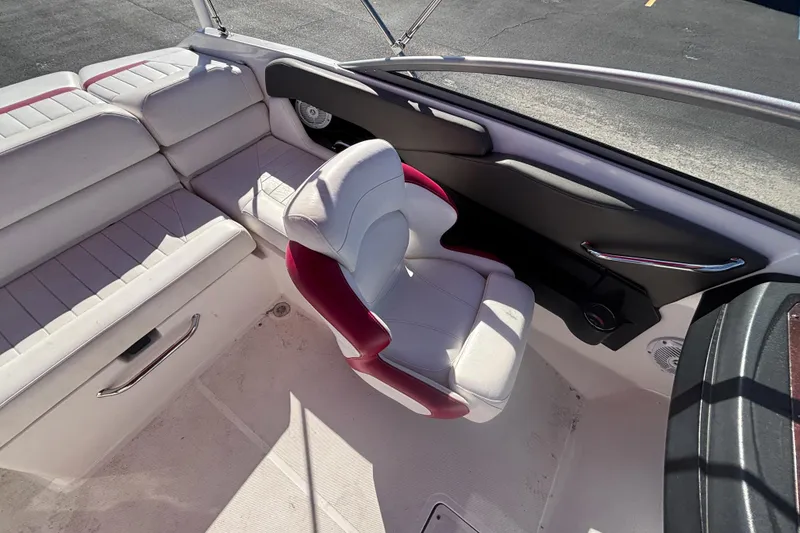 Slide: The Image of 2008 Regal 2000 Bowrider interior with white and red seating, sleek design. - 18