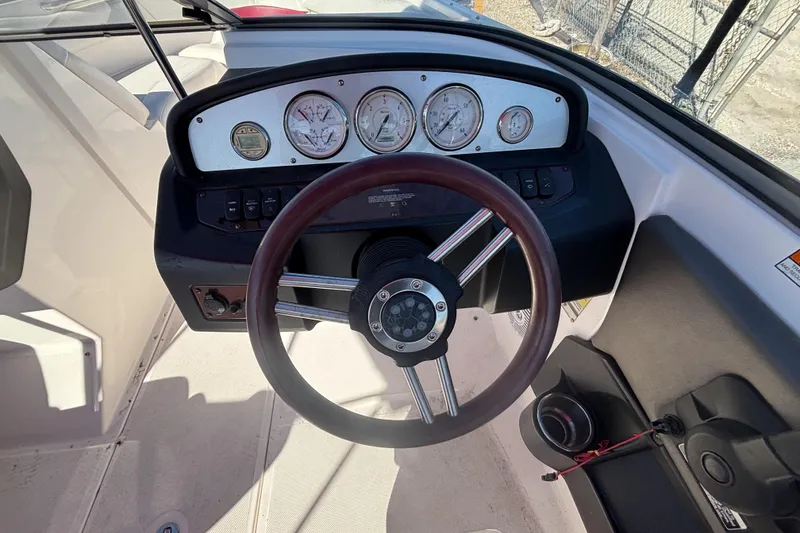 Slide: The Image of Steering wheel and dashboard of a 2008 Regal 2000 Bowrider boat. - 20