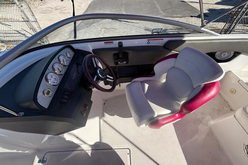Slide: The Image of 2008 Regal 2000 Bowrider boat cockpit with steering wheel and gauges. - 24