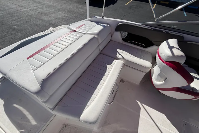 Slide: The Image of 2008 Regal 2000 Bowrider interior with white and red seating, showcasing spacious design. - 26