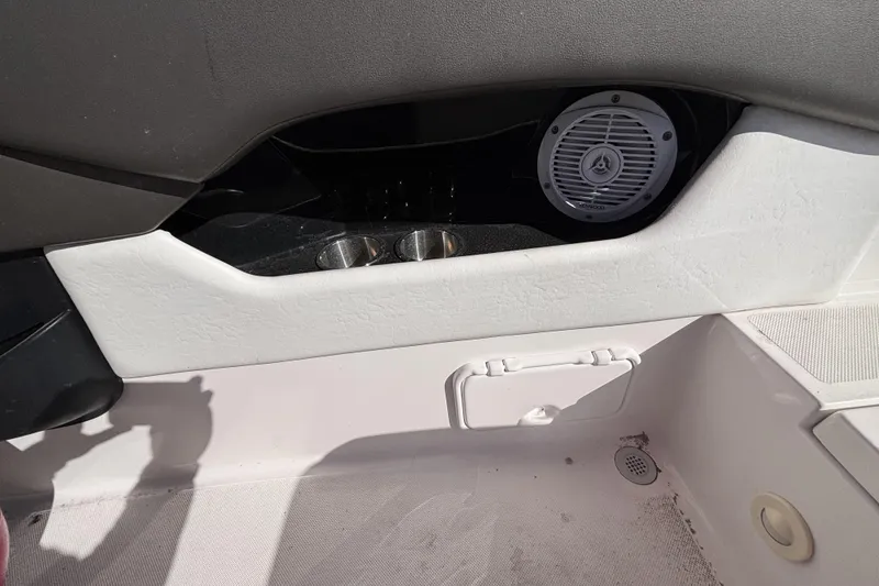 Slide: The Image of Interior of 2008 Regal 2000 Bowrider boat with speaker and cup holders. - 27