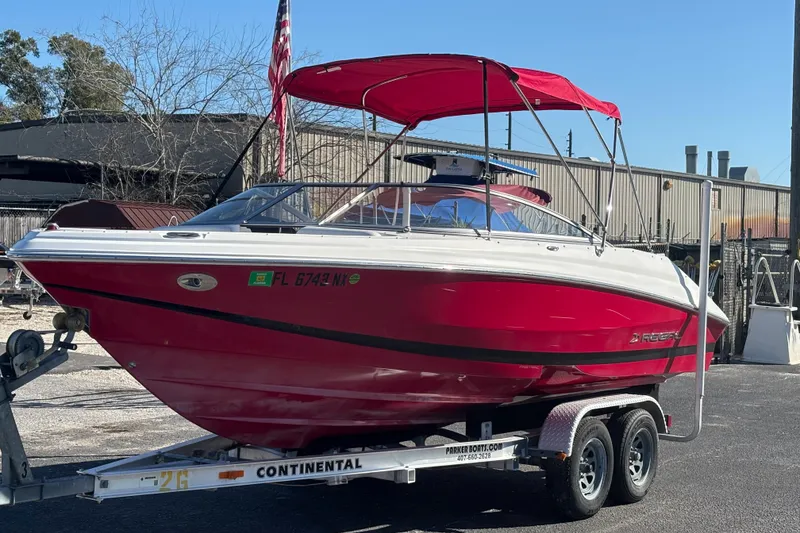 Slide: The Image of Red 2008 Regal 2000 Bowrider boat on trailer, parked outdoors. - 8