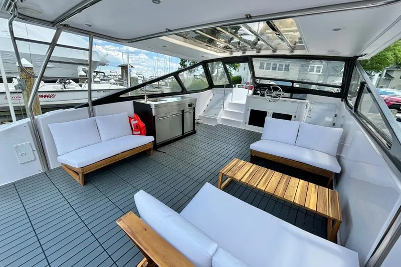 Slide: The Image of Spacious interior of 2019 Gemini Freestyle 399 Power boat with modern seating and helm. - 4