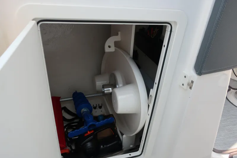 Slide: The Image of Storage compartment in 2021 Chaparral 267 SSX boat, featuring equipment and accessories. - 10