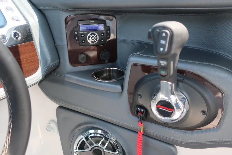 Slide: The Image of 2021 Chaparral 267 SSX boat dashboard with controls and audio system. - 12