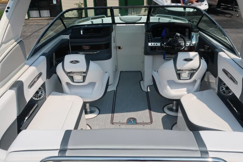 Slide: The Image of Interior of 2021 Chaparral 267 SSX boat with modern seating and dashboard. - 18