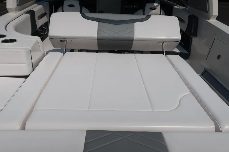 Slide: The Image of 2021 Chaparral 267 SSX boat interior with white and gray seating. - 20