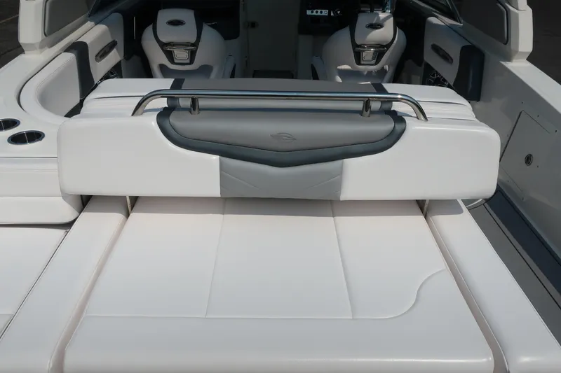 Slide: The Image of 2021 Chaparral 267 SSX boat interior with luxurious white seating and modern design. - 21